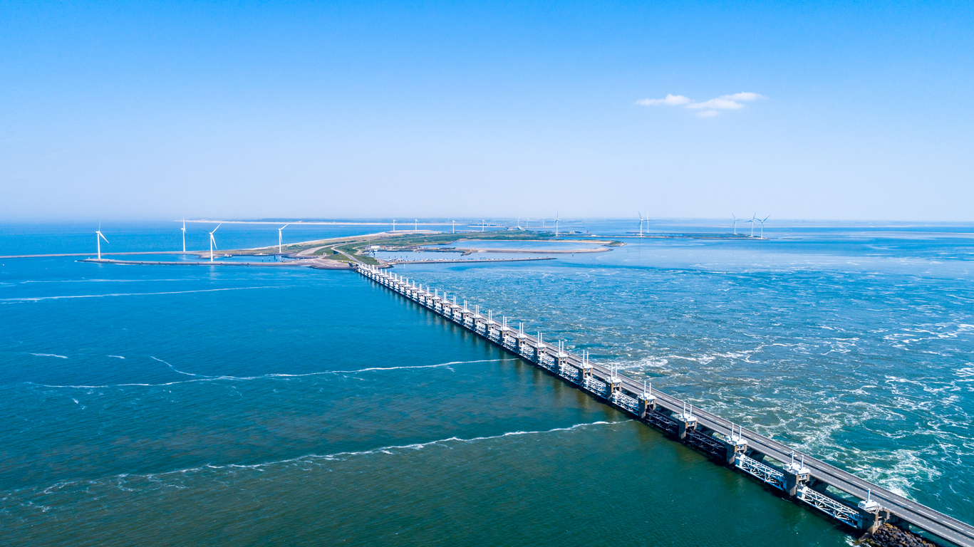 Oosterschelde flood barrier with windmills in the Netherlands at the Northern Sea taken from above with a drone